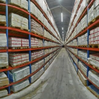 A close-up of a warehouse racking system with various accessories